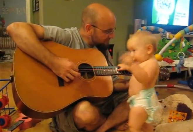 When daddy plays his guitar, you will laugh how much this baby rocks out!